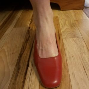 Red low heeled pumps